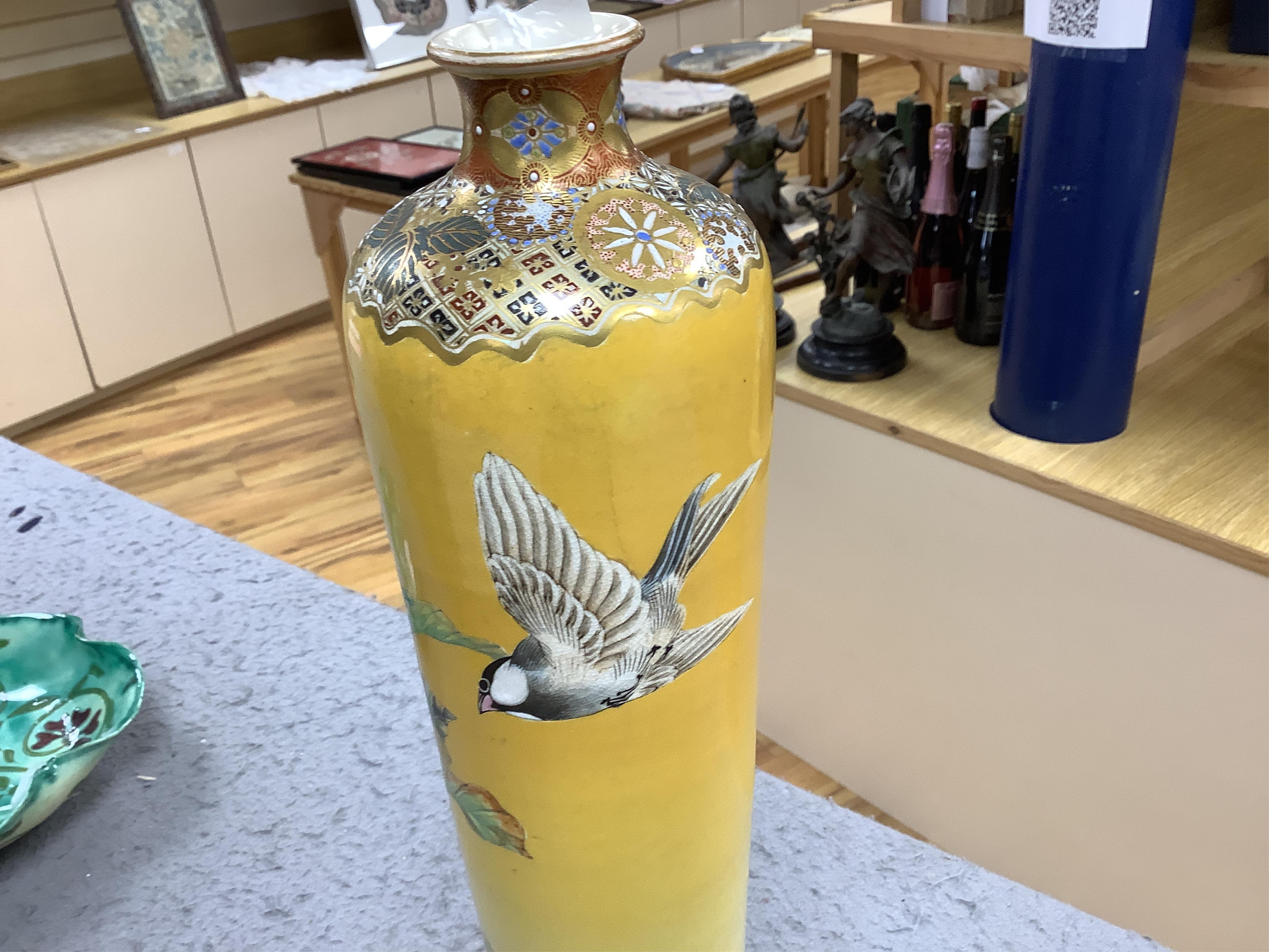 A Japanese Satsuma tall vase, Meiji period, by Taizan Yohei III, decorated with birds and blossom on a yellow ground, signed, 37cm high. Condition - hairline crack, otherwise good condition